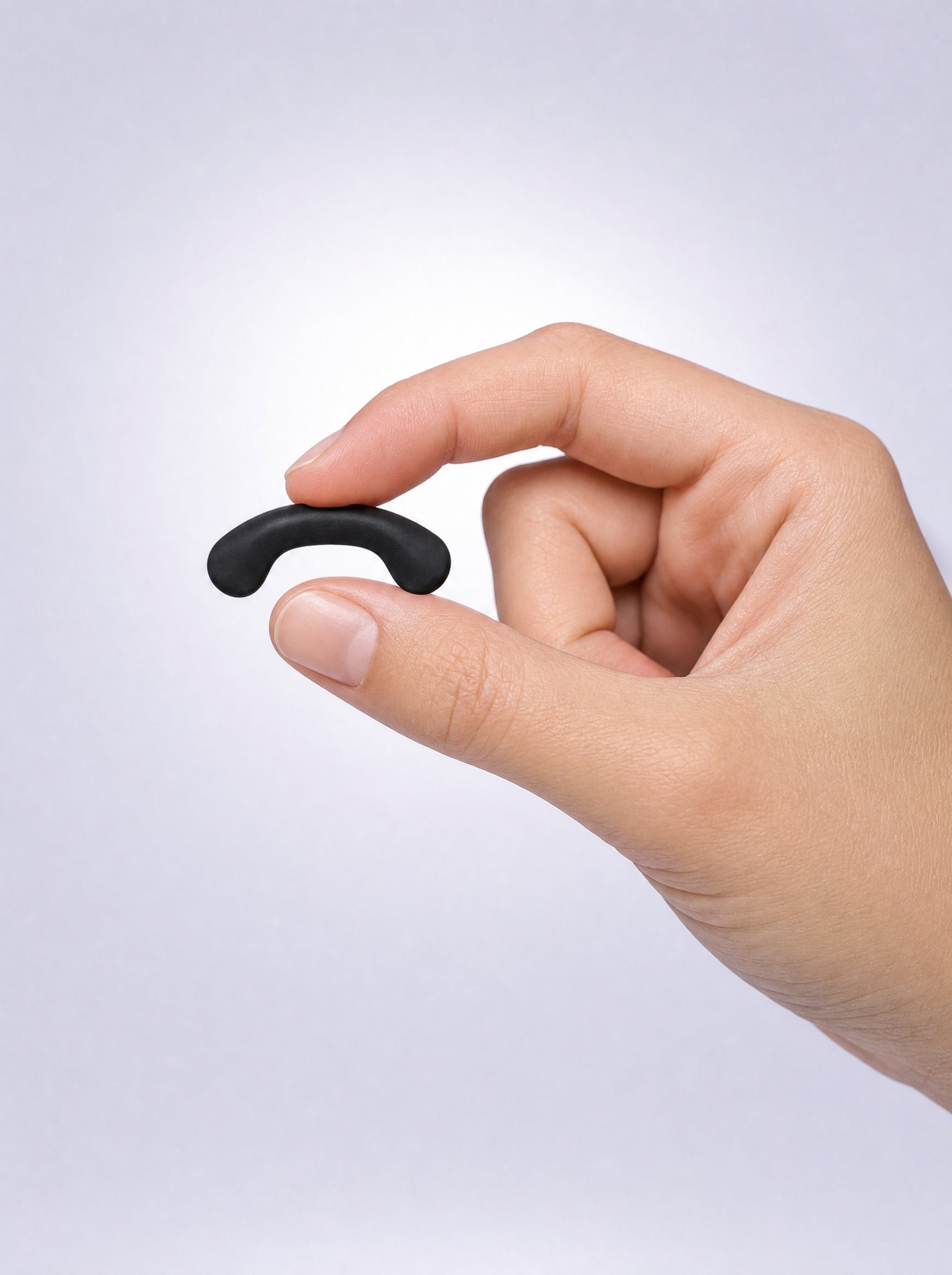 FYROST Zephyr held between fingertips for scale